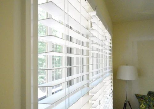 Installing White Faux Wood Window Blinds: a house log