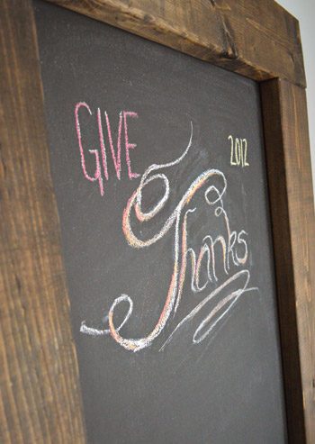 Give Thanks chalk lettering on Hands-on magnetic chalkboard with wood framed