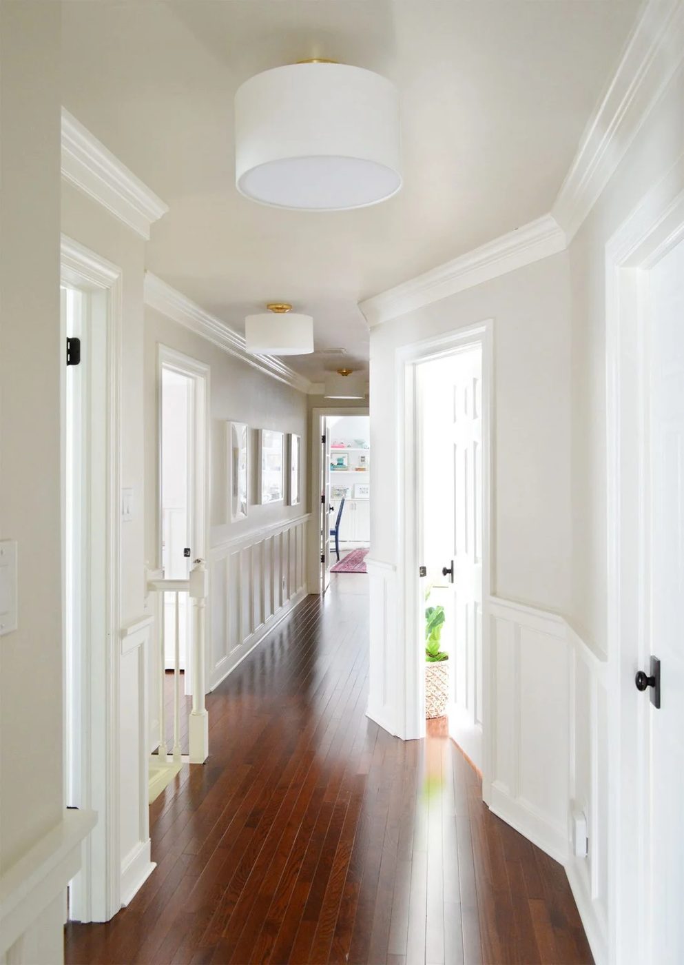 After Photo Of Hallway With Wood Floors And Hands-on Wainscoting Treatment Towards Bonus Play Room