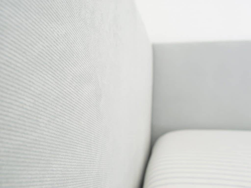 Fabric detail on Hands-on upholstered headboard with subtle blue ribbing