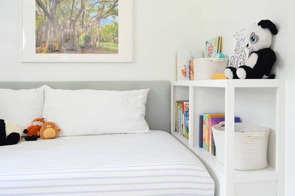 Custom Hands-on Bookshelf At Foot Of Boys Room Daybed With Upholstered Headboard