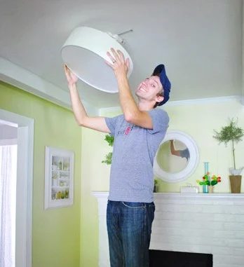 A Flush Mounted Light Near The Fireplace: a house log