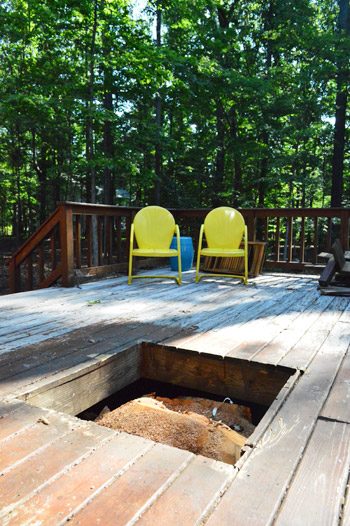 Hole in wooden deck left by took out tree