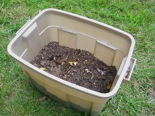 dirt wet in homemade compost bin
