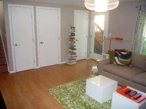 A Family Room Makeover Alongside A Green Rug