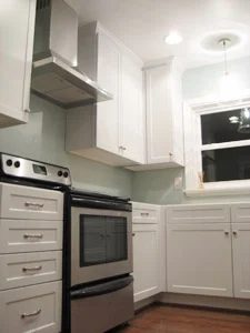 A Stainless Steel Hood In The Kitchen: a house log