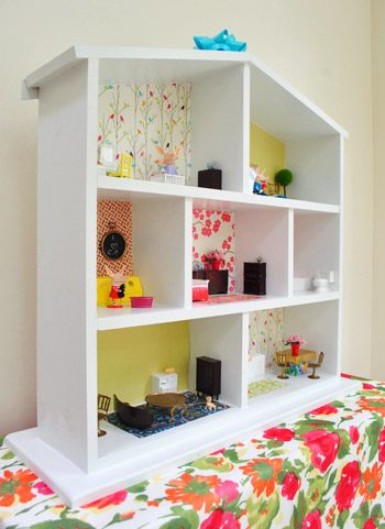 Side View Of Straightforward Hands-on Dollhouse With Wallpaper Backgrounds