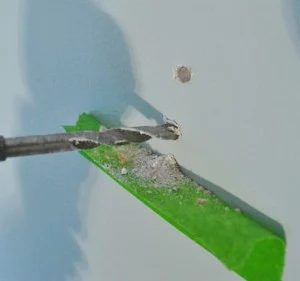 Use Painter’s Tape To Catch Drill Dust, step by step