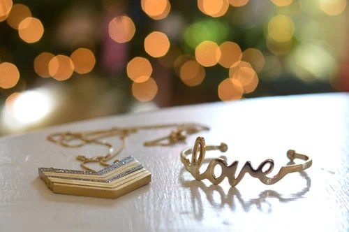 Maternity Portraits In Front Of The Christmas Tree: a house log