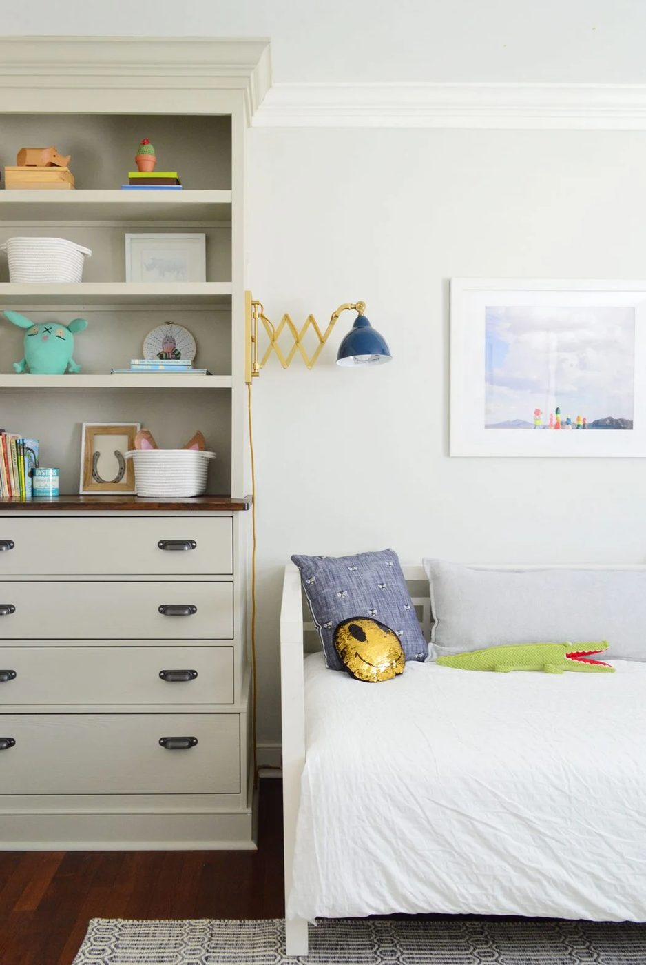 Built-In Bookcases In Boys Bedroom With Accordion Reading Lights Over Daybed