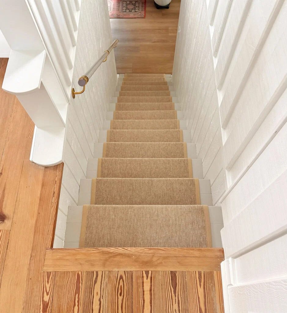 View of Upstairs and Downstairs Floors Down Staircase with Sisal Runner