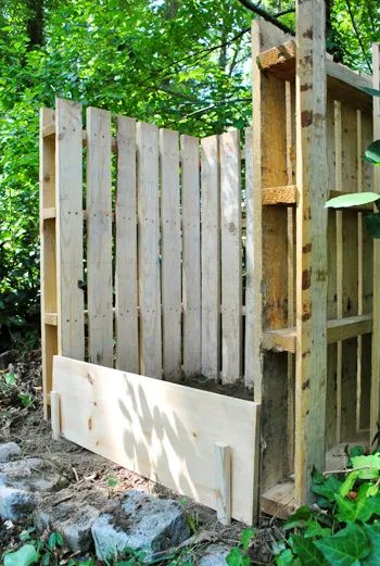 homemade compost bin made from pallets