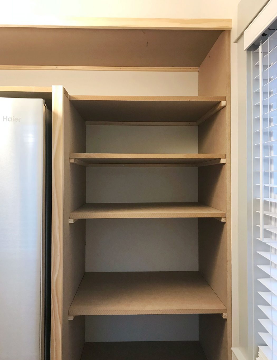 pantry shelves brought in on side of walk-in pantry