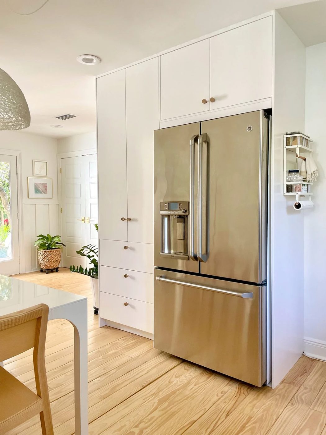 Ikea Built-In Pantry Cabinets Around Stainless Steel Refrigerator