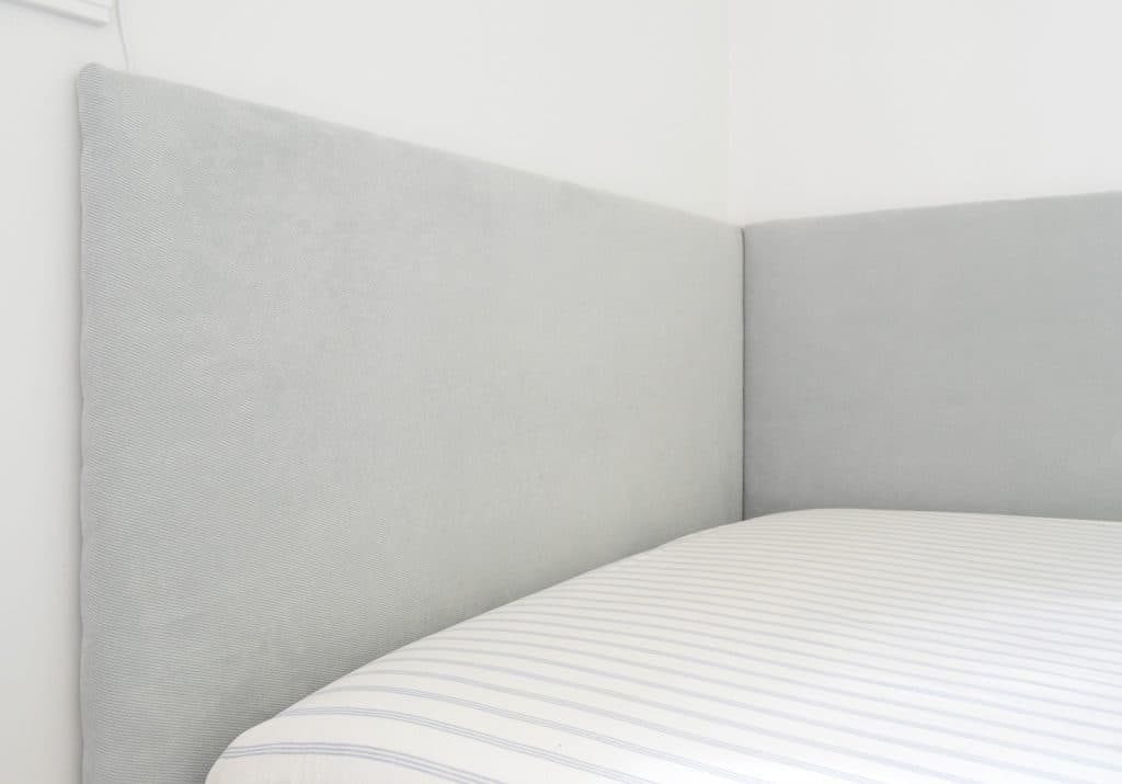 Close up of wrapped up Hands-on headboard on two sides of built-in daybed in boys bedroom