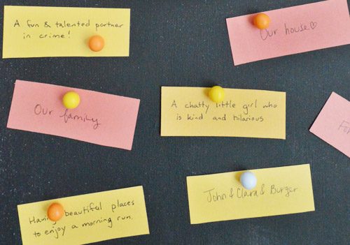 Thanksgiving gratitude notes held to magnetic Hands-on chalkboard with round magnets