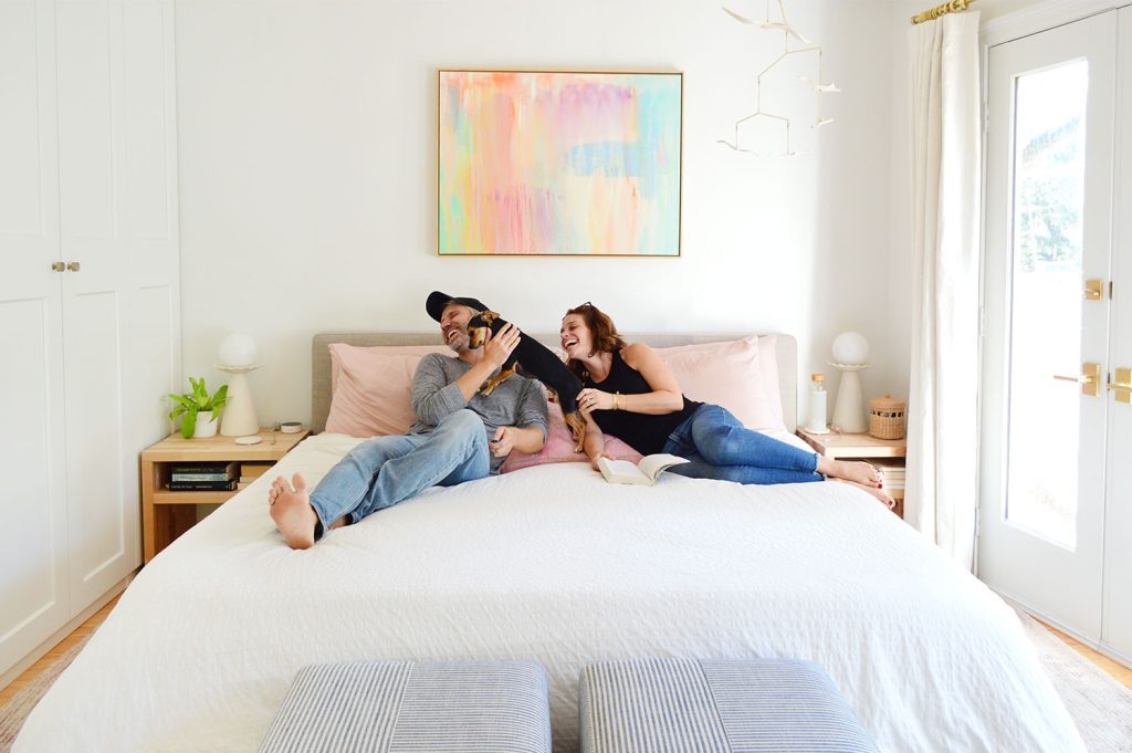 Dog Making The house team Laugh On King Size Bed With White Bedding