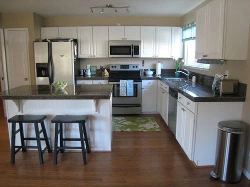Replacing A Tiled Kitchen Counter Alongside Dark Granite