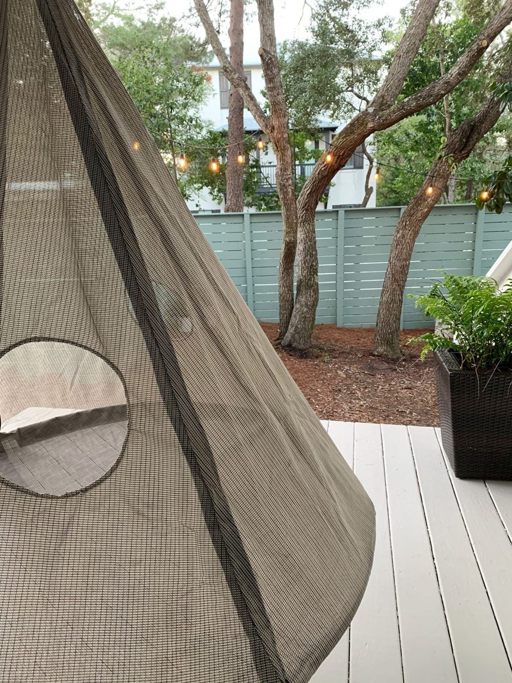 Detail of netted side of hanging porch tent