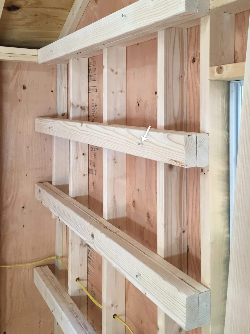 temporary screws into horizontal shelf supports for garage shelving