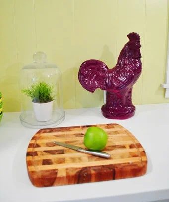 A Giant Rooster In The Kitchen: a house log
