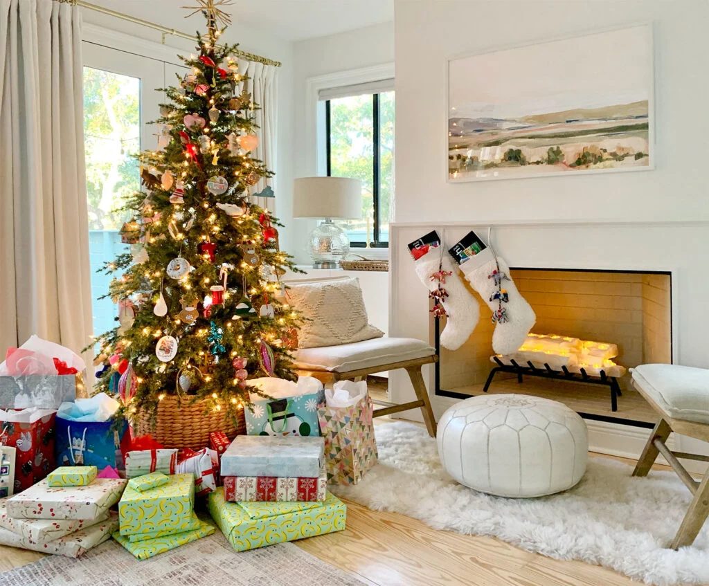 Christmas Tree In Bedroom. Next To Fireplace With Gifts Under