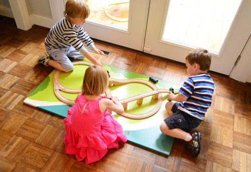 Kids Playing With Hands-on Train Board at Birthday Party