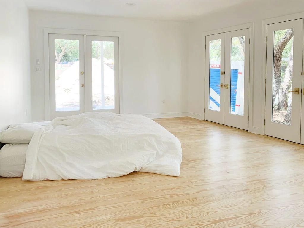 Mattress on the floor of an empty bedroom