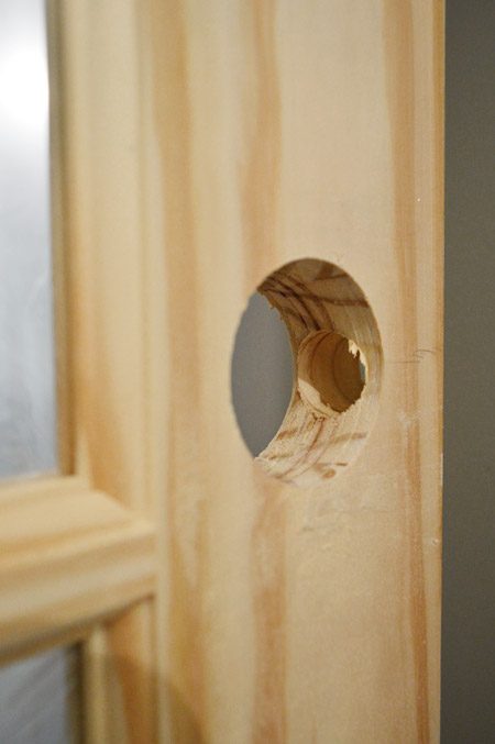 Wrapped up Holes Created In Door Using Door Knob Template Kit From Ryobi