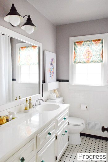 After of Hall Bathroom With Black And White Tile And Gray Walls Hands-on frame around vanity mirror