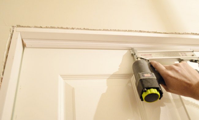 Nailing In Door Stop Trim Into Hands-on Jamb Kit Construction With Nail Gun