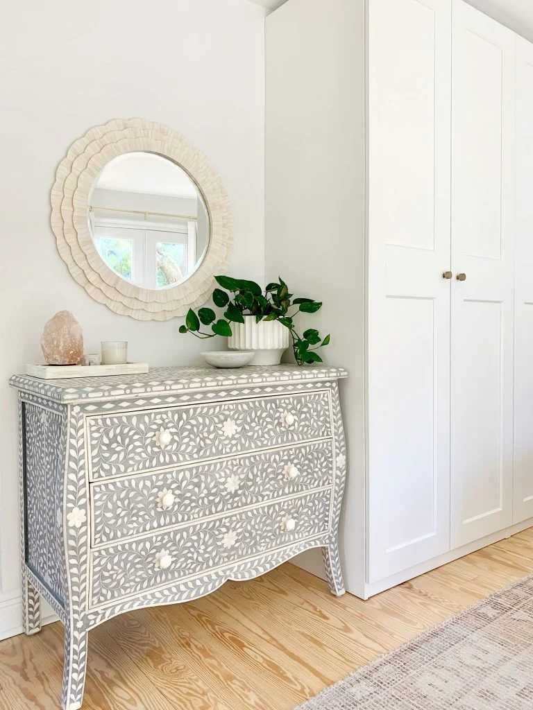 Blue inlay dresser next to Ikea Pax wardrobes with white bone inlay mirror