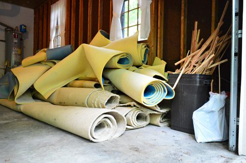 stacks for old carpet rolls ready for removal