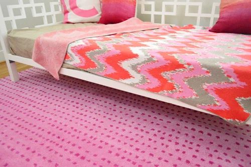 A Lively Pink Polka Dot Rug For The Playroom