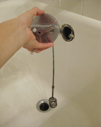 removing overflow cover in clogged bathroom drain
