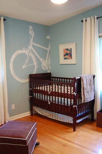 A Blue Nursery Alongside A Bike Mural