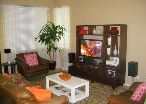 Neutral Living Room Alongside A Leather Sofa & Dark Wood Furniture