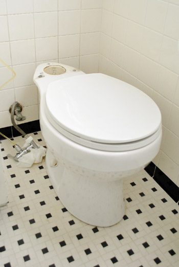 Toilet bowl with tank took out during wax ring repair
