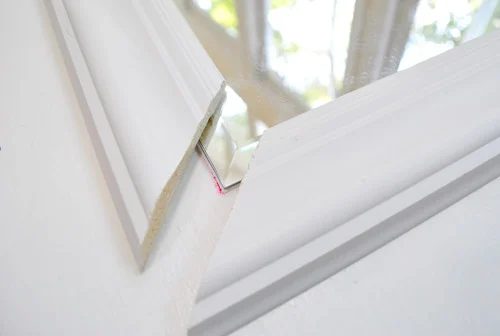 Framing Out A Mirror That is Mounted On A Door