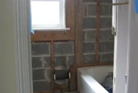 How to Remove Tile, Mortar, and Metal Mesh from Bathroom Walls