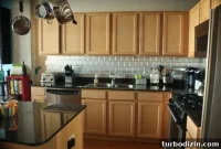 DIY Stainless Steel Stick-On Backsplash for $100 or Less