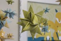 DIY Baby Mobile Featuring Folded Moravian Star Ornaments