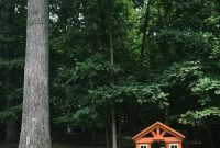 Add a Charming Wooden Playhouse to Your Backyard