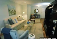 Pale Blue Living Room Makeover With a Warm Tan Rug