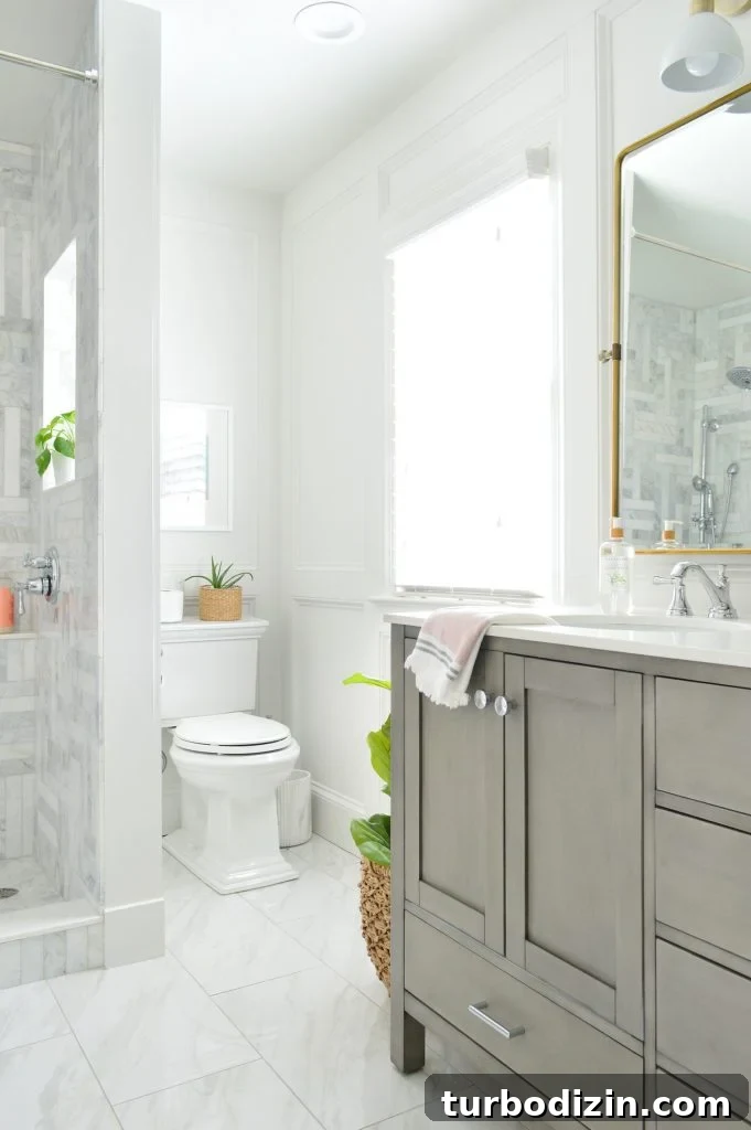 Our Favorite Toilet: A Complete Guide to the Top Pick 7 View of toilet in back corner of marble bathroom with gray vanity