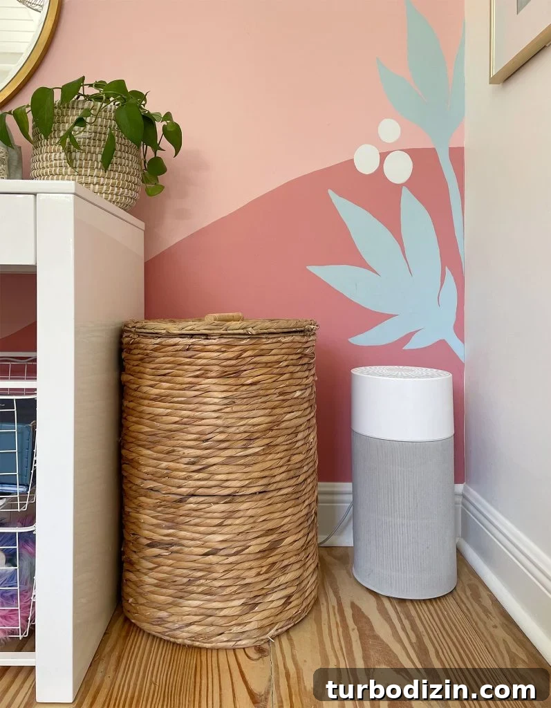 Top Home Air Purifiers for Cleaner Indoor Air 14 Smaller Blueair 411 Air Puriifer In Front Of Colorful Wall Mural
