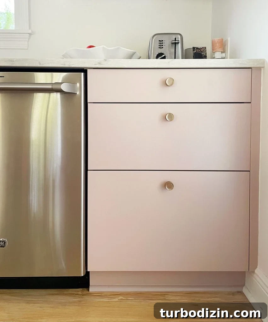How to Paint IKEA Kitchen Cabinets Like a Pro 17 Completed Ikea kitchen with painted drawer fronts and brass knobs