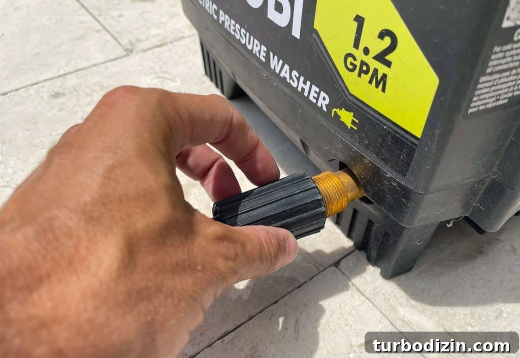 Screwing high pressure hose to side of Ryobi Electric Pressure Washer