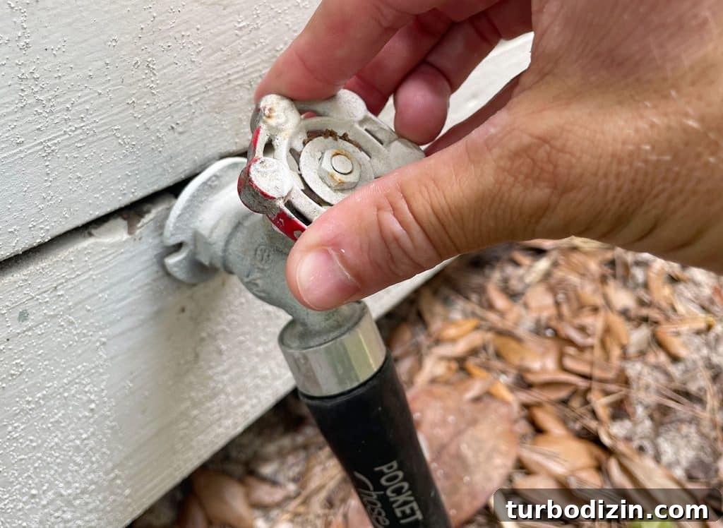 Turning on water at outdoor hose bib for pressure washing