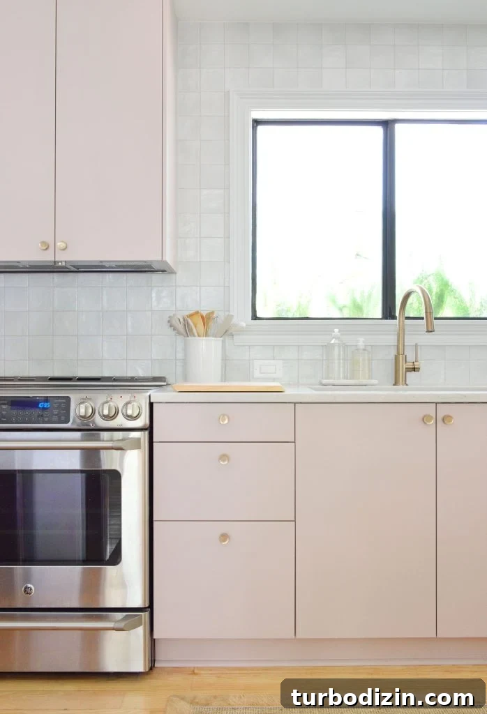 Ikea Kitchen Makeover: Smart Renovation Ideas for Small Spaces 10 Vertical View Of Mauve Pink Painted Ikea Kitchen Cabinets With Gray Tile Backsplash